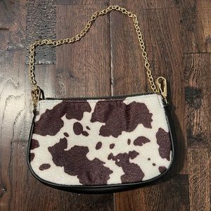 Cowprint black and white shoulder bag with gold chain